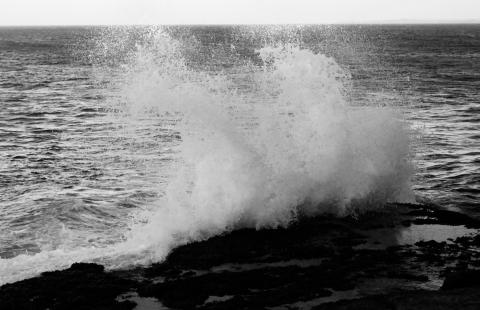 wave breaking on rocks